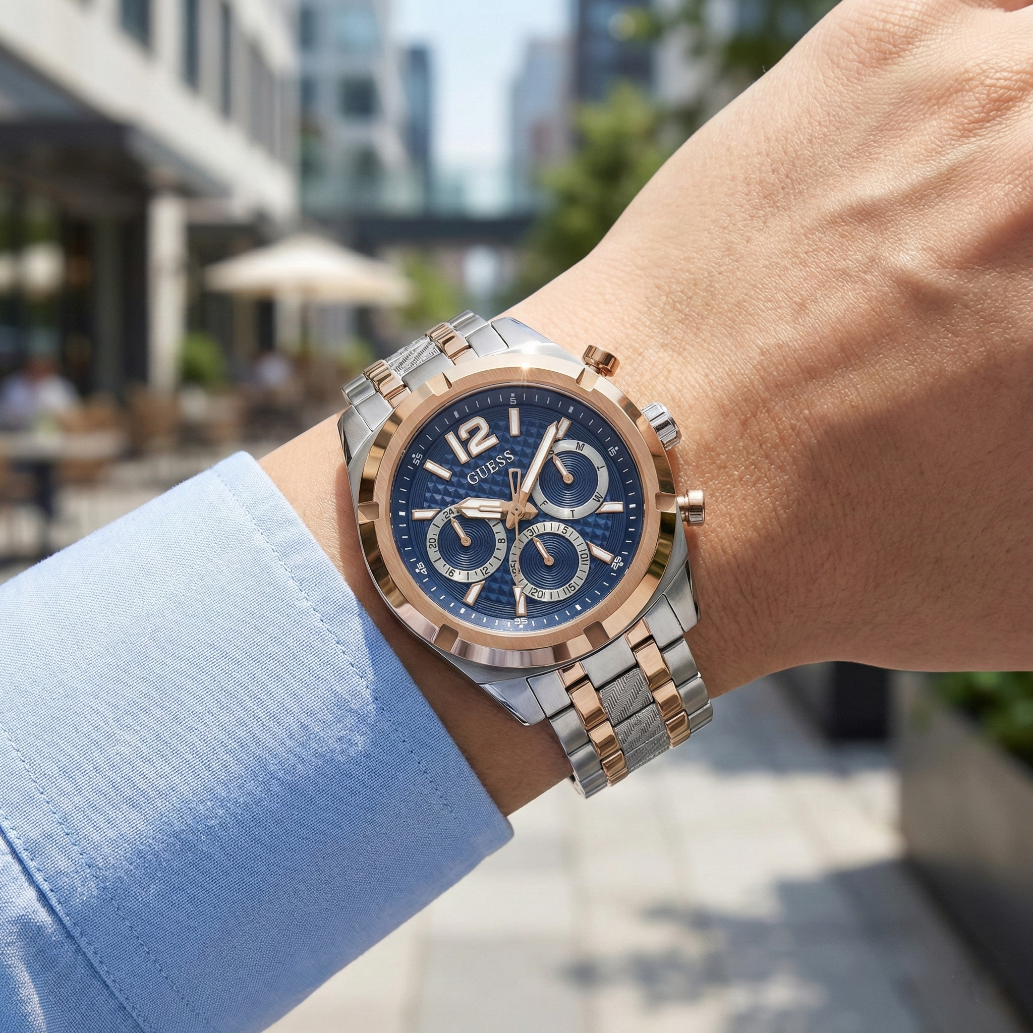 Detailed view of the blue patterned dial and rose gold accents on Guess GW0714G3