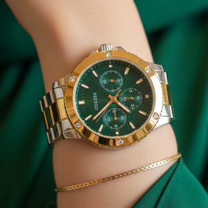 Close up shot of Guess Mist GW0723L1 watch on wrist showing the vibrant green dial and crystal bezel