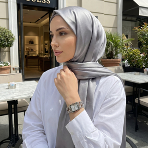 Woman wearing Guess Mod Heavy Metal W1117L1 silver watch with a chic modern outfit