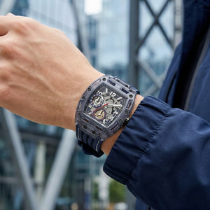 Close up shot of Guess Phoenix GW0499G1 watch on wrist showing the blue multifunction dial and industrial screws