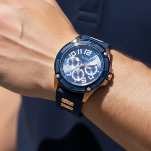 Close up shot of Guess Rig GW0051G3 watch on wrist showing the industrial bezel and rubber strap details