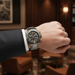 Modern man wearing Guess Traction GW0800G2 gunmetal watch with a stylish casual outfit