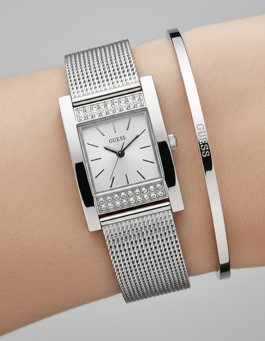 Close up shot of Guess W0127L1 watch on wrist showing the crystal accents and rectangular dial