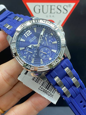 Authentic real-life photo of the Guess W0366G2 showing actual silver shine and blue rubber color in Egypt