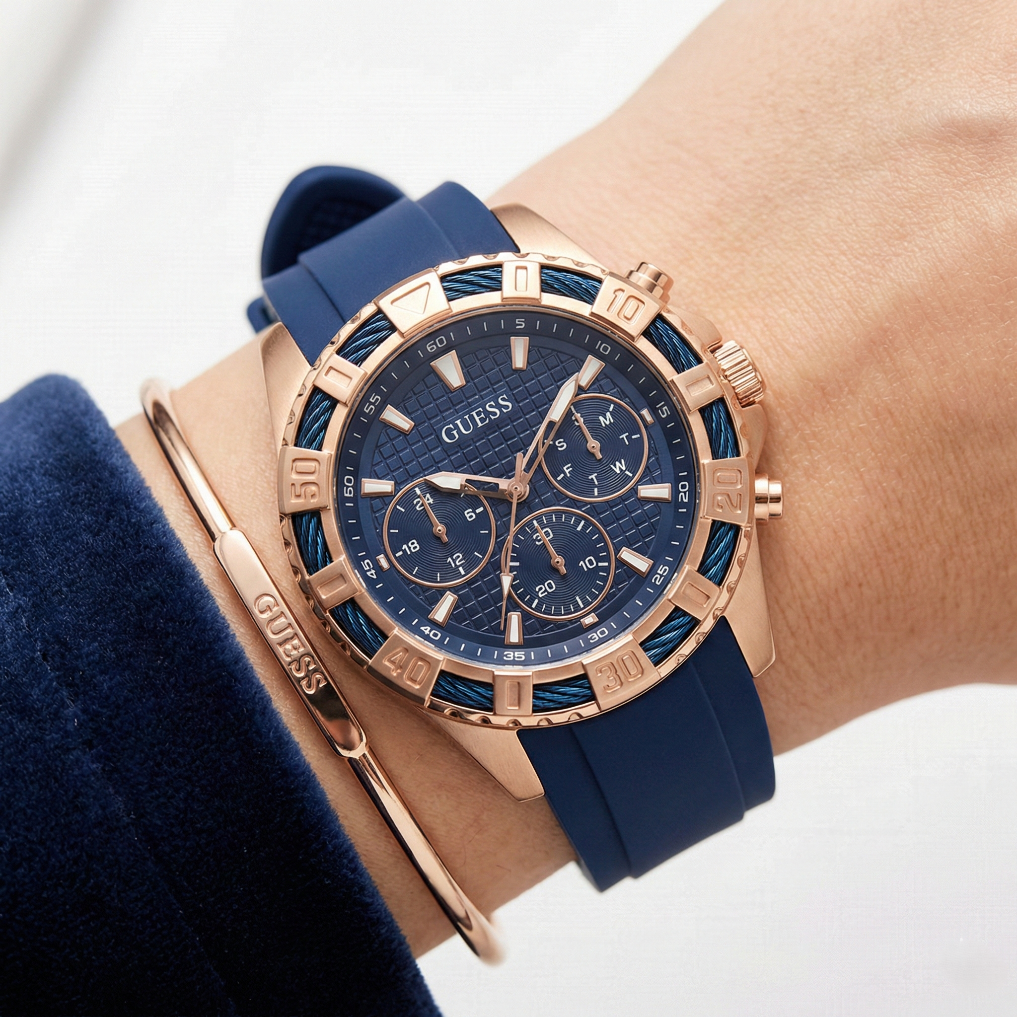 Close-up of Guess W0562L3 showing the textured blue dial and multifunction sub-dials