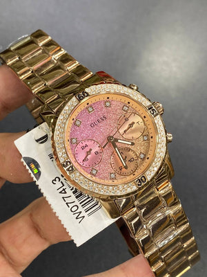 Real-life photo of Guess Confetti W0774L3 watch showing actual shine and glitter