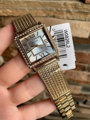 Authentic real-life photo of the Guess W0826L2 showing actual gold mesh texture and crystal shine in Egypt