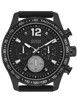 2. Macro shot of Guess W0971G1 on a masculine hairless wrist highlighting the black dial and white stitching