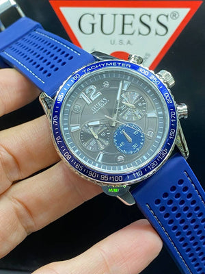 Authentic real-life photo of the Guess W0971G2 showing actual silver shine and blue bezel details in Egypt