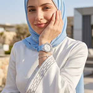 Close up shot of Guess W1053L5 on wrist showing the white dial with multi-function sub-dials and silver crystal bezel details