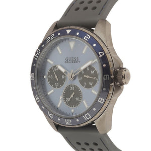 Angled view of Guess W1108G6 showing the gunmetal grey case and blue sport bezel