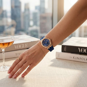 Close up of Guess Cosmo GW0034L4 women's quartz battery watch on wrist showing blue sunray dial and luxury crystal bezel