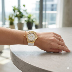 Close up of Guess Venus GW0118L5 women's quartz battery watch on wrist showing clean white dial and luxury baguette crystal bezel