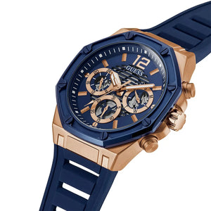 Right angled view of Guess Momentum GW0263G2 men's quartz battery watch highlighting rose gold finish and blue bezel details