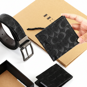 Hand holding Coach textured leather wallet and removable card holder insert