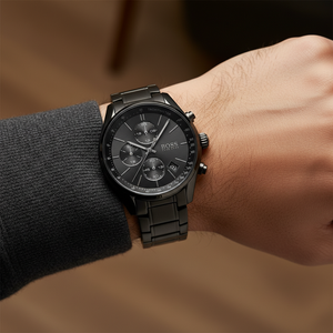 Detailed macro view of the black sunray dial and tachymeter bezel of Hugo Boss 1513676