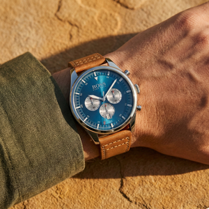Close up shot of Hugo Boss Pioneer 1513709 on wrist showing the blue dial and vintage chronograph sub-dials