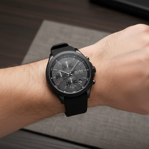 Detailed macro view of the textured black dial and chronograph sub-dials of Hugo Boss 1513720