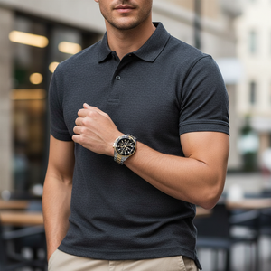 Male model wearing Hugo Boss Admiral 1513908 two-tone watch with a sophisticated outfit