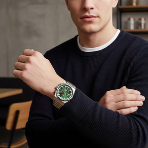 Male model wearing Hugo Boss Candor 1514220 silver and green watch with a casual outfit