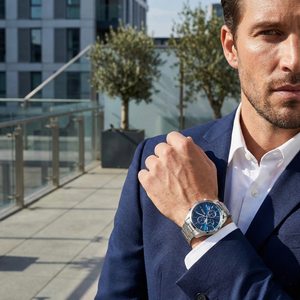 Man wearing Hugo Boss Grand Prix silver watch reflecting a versatile business casual look