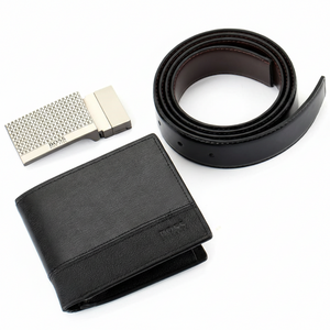 Close-up of a Hugo Boss black leather belt highlighting the brushed metal buckle with a sophisticated textured geometric pattern and engraved branding