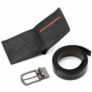 Interior view of a Hugo Boss black leather wallet showing card slots with a signature red accent and a secure coin compartment