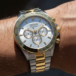 Close up shot of Hugo Boss Ikon 1512960 watch on wrist showing the silver dial and gold sub-dials