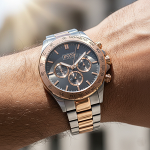 Close up shot of Hugo Boss Ikon 1513339 watch on wrist showing the grey dial and rose gold tachymeter