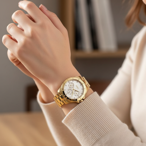 Woman wearing elegant Hugo Boss Majesty 1502445 watch in gold tone