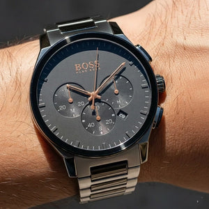Close up shot of Hugo Boss Peak 1513814 watch on wrist showing the black dial and silver logo