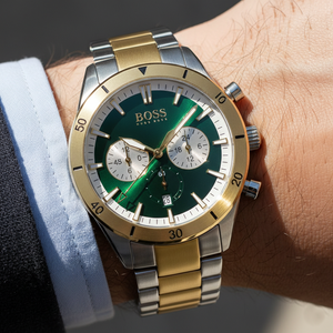 Close up shot of Hugo Boss Santiago 1513872 watch on wrist showing the green sunray dial and gold hands