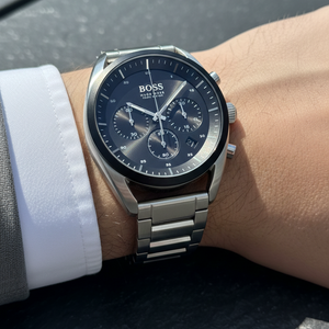Close up shot of Hugo Boss Top 1514093 watch on wrist showing the blue sunray dial and silver hands