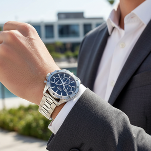 Male model wearing Hugo Boss Troper 1514057 silver watch with a black suit