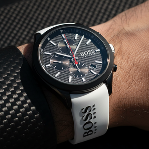 Close up shot of Hugo Boss Velocity 1513718 watch on wrist showing the black dial and red hands contrast