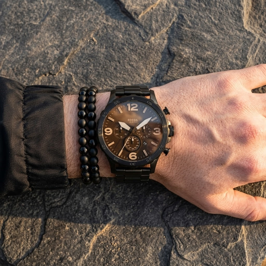 Close up shot of Fossil JR1356 on wrist showing black chronograph dial with white markers and amber tint