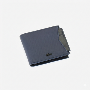 Straight-on front view of a closed Lacoste men's navy blue grained leather wallet showing the black crocodile logo and the edge of the removable card holder insert