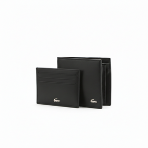Interior view of an open Lacoste men's black leather wallet featuring a snap-button coin pocket and card slots, placed next to a matching separate cardholder