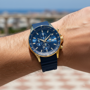 Detailed macro view of the blue dial, gold Trident logo, and sub-dials of Maserati R8871640004