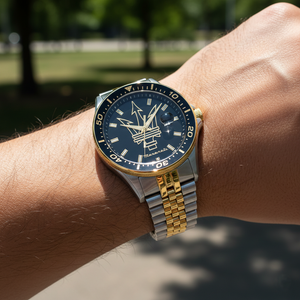 Close up shot of Maserati Sfida R8853140009 on wrist showing the gold trident logo and two-tone jubilee bracelet