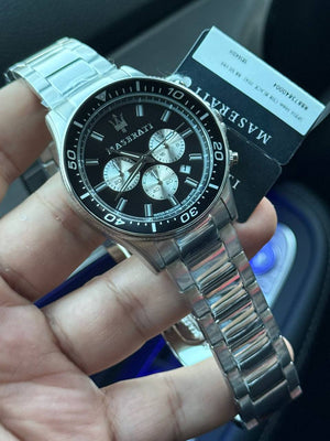 Authentic real-life photo of the Maserati Sfida R8873640004 watch showing actual black bezel and reverse panda dial