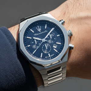 Close up shot of Maserati Stile R8873642006 on wrist showing the textured blue dial and chronograph details