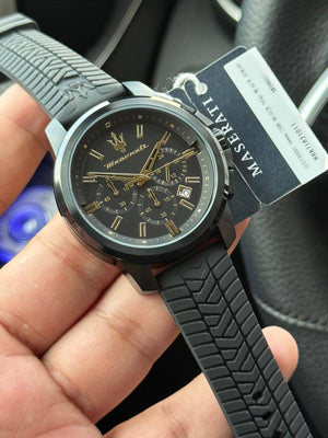 Authentic real-life photo of the Maserati Successo R8871621011 watch showing actual black finish and gold accents
