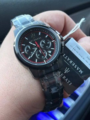 Authentic real-life photo of the Maserati Successo R8873621014 watch showing actual black metal finish and red accents