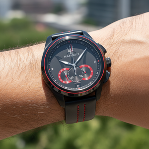Close up shot of Maserati Traguardo R8871612023 on wrist showing the black dial and red racing sub-dial rings