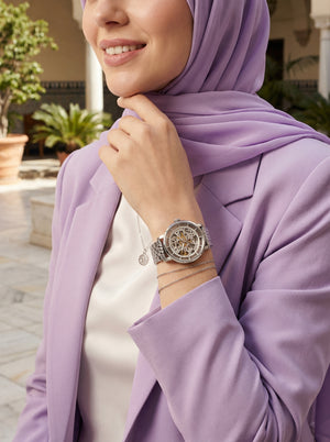 Lifestyle photo of Fossil ME3067 showing the bold silver automatic watch on a woman's wrist