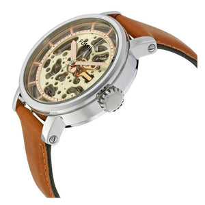 Angled real-life photo of Fossil ME3109 showing the polished silver case and tan leather
