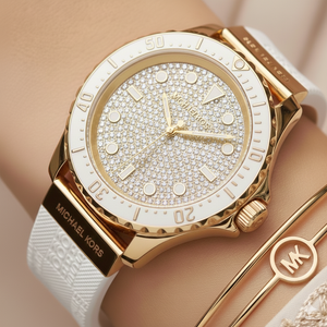 Close up of the MK7357 gold dial showing the intense full pavé crystal encrusting and luminous markers