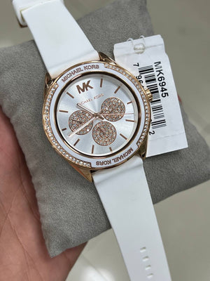 Side profile of the polished rose gold-tone case and crown on the Michael Kors MK6945