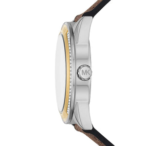 Side-on shot of the MK7205 two-tone case emphasizing the gold-tone textured crown and sleek architectural lugs